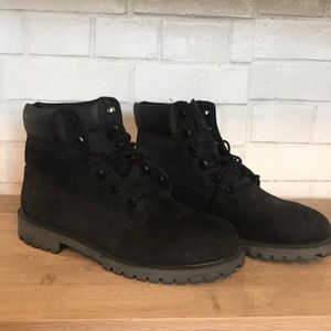 Black on black Timberland work boots.